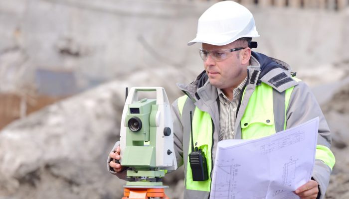 Surveyor At Consruction Site